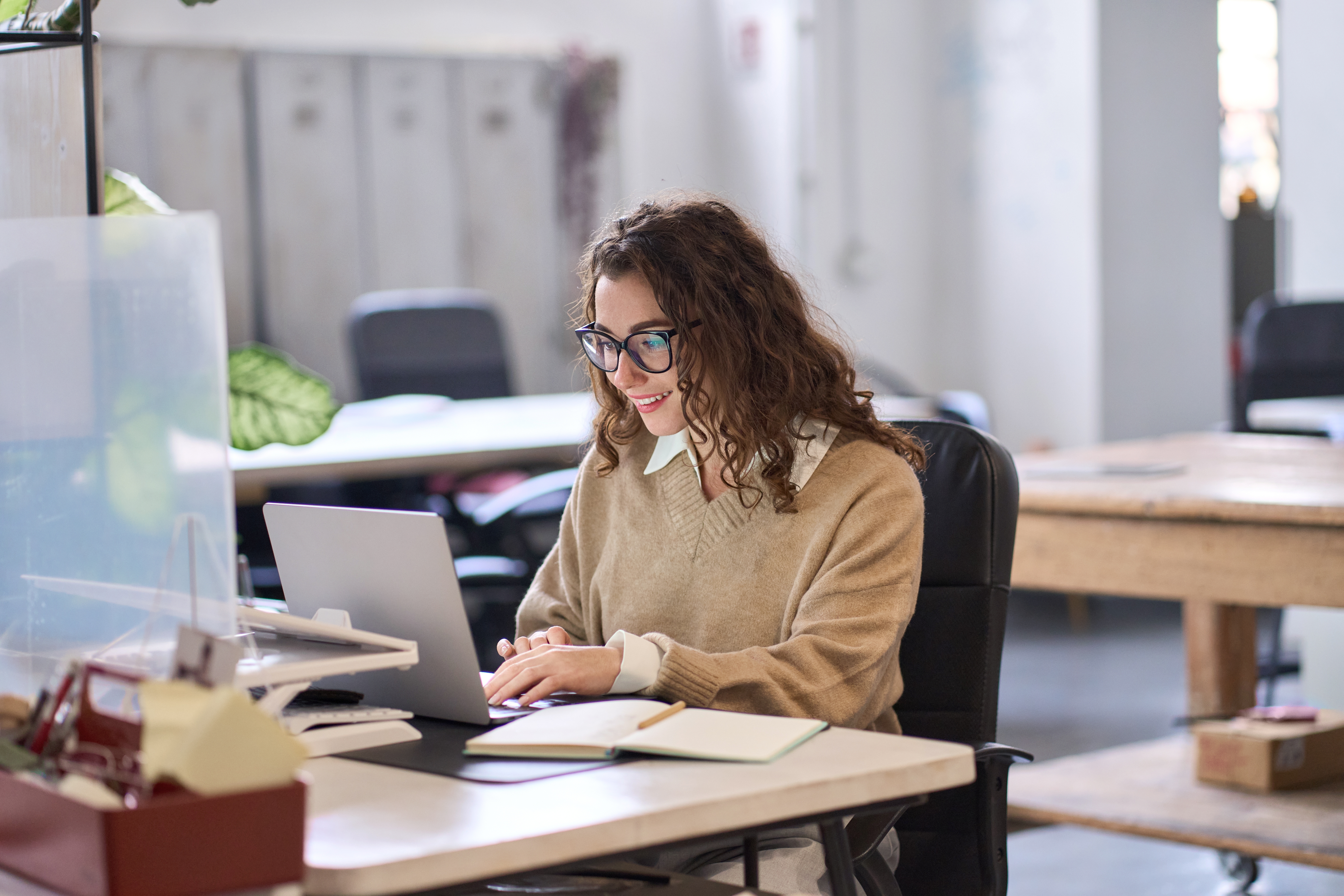 young professional woman working on laptop